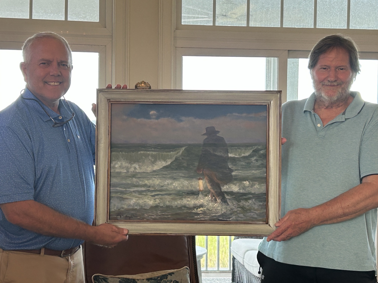 Danny presenting a finished painting